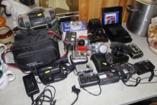 A quantity of various cameras to include Olympus,