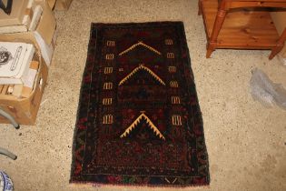 An approx. 130cm x 74cm Baluchi rug
