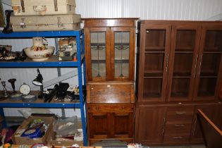 An early 20th Century oak bureau bookcase with lea