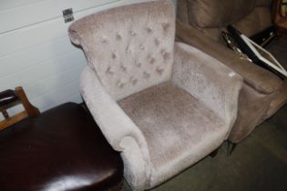 A button back upholstered armchair