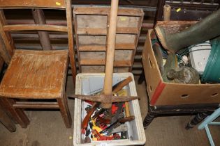 A box containing a mattock; various hand tools and