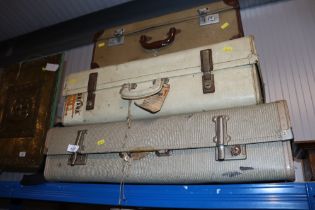 Three vintage suitcases together with a satchel