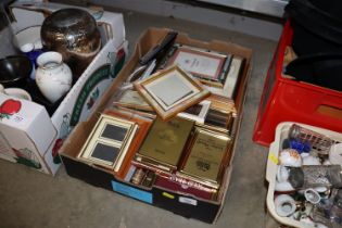 A box containing various picture frames