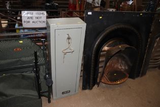 A metal gun cabinet with keys