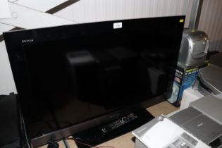 A Sony flat screen television with remote control