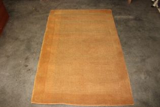 An approx. 5'6" x 3'7" yellow hearth rug