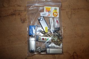A quantity of table lighters, bottle openers, holo