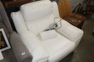 A white leather upholstered reclining armchair tog