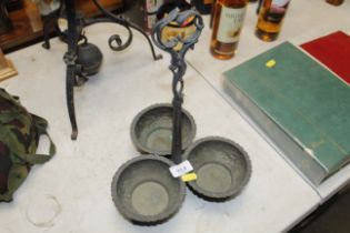 A plated three section bottle stand