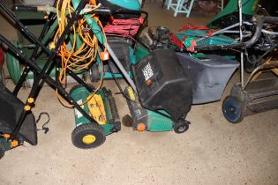 A push cylinder mower and a Black & Decker lawn ra