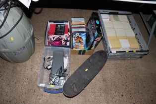 Two boxes containing skate board, DVDs, a caravan