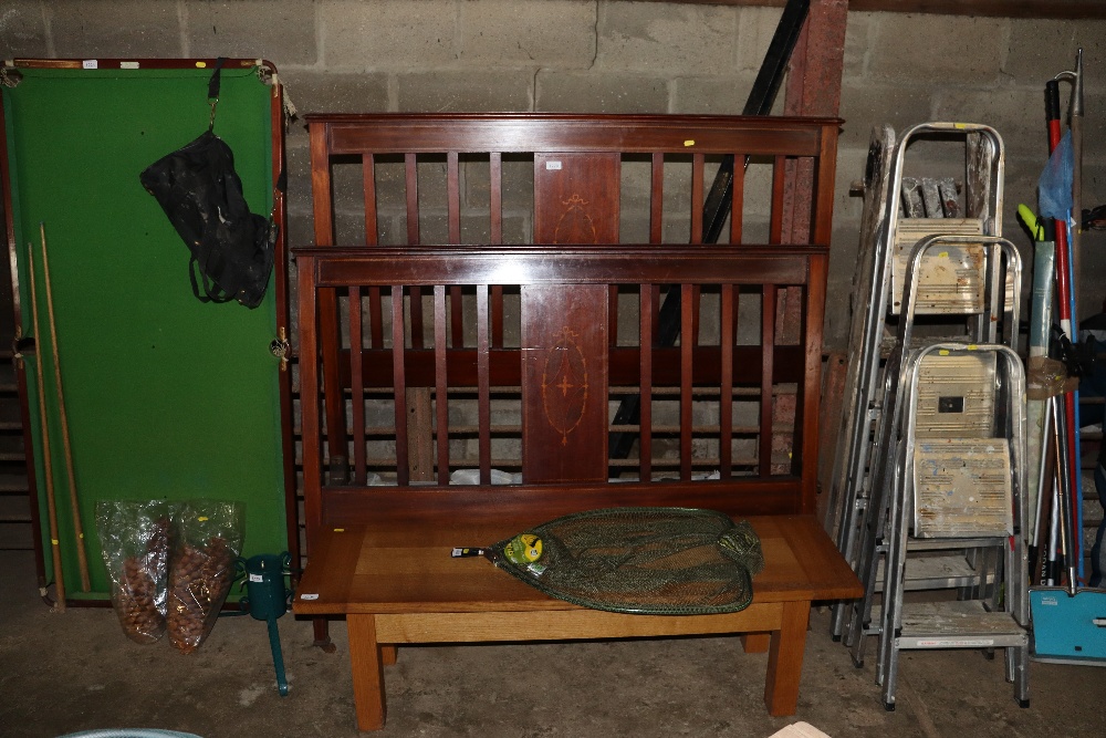 An Edwardian mahogany and inlaid double bed frame