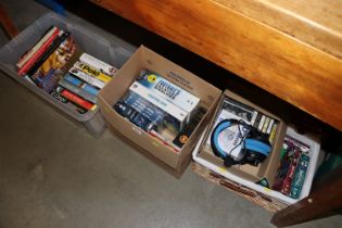 Four boxes containing DVDs, books and CDs