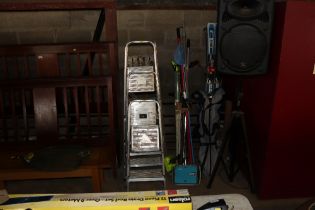 A wooden step ladder; three aluminium ladders and