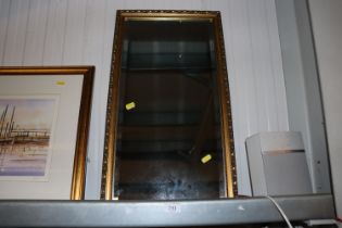 A gilt framed bevel edged wall mirror