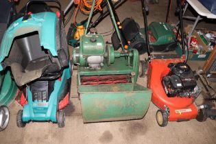 A Ransomes petrol cylinder lawn mower