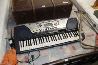 A Yamaha electric keyboard with stand