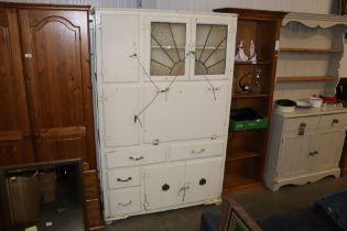 A 1930s kitchen cabinet fitted four drawers