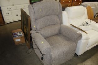 A grey upholstered electric recliner