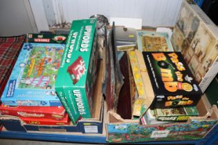 Two boxes containing board games and puzzles
