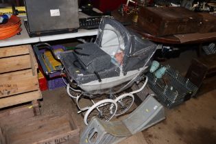 A Silver Cross pram; bag and a baby doll