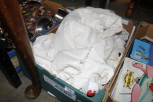 A box of various clothes and textiles