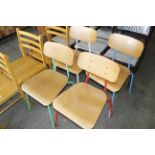 A set of four ply and metal stacking chairs