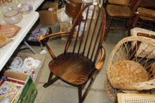 A dark Ercol stick back rocking chair