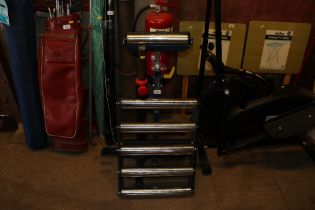 Two metal rollers with stands