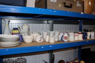A collection of various mugs, blue and white teapo