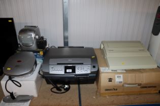 An Epson printer/scanner, a Silver Reed typewriter