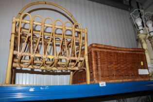 Two wicker baskets and a cane magazine rack