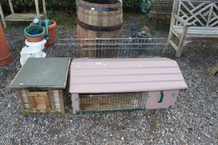 A rabbit hutch, chicken coop and pet cage