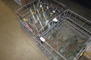 Two crates with contents of various milk bottles