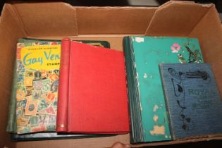 A box containing various stamp albums and contents