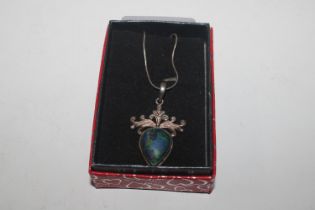 A 925 silver pendant set with coloured stone hung