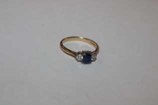 An 18ct gold sapphire and diamond set ring, ring s