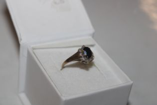 A 9ct gold sapphire and diamond set ring, size L/M