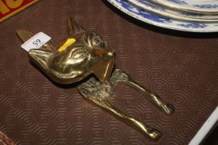 A brass fix head door knocker