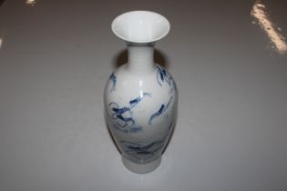 A Chinese blue and white vase decorated with crayf