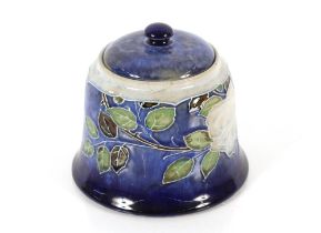 A Doulton pottery jar and cover with leaf decorati