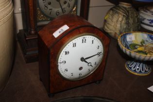 A walnut cased mantel clock