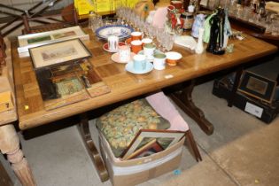 A oak parquetry topped dining table on trestle end