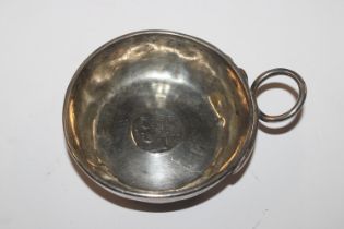 A white metal wine taster inset with coin, approx.