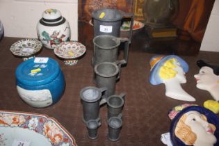 A set of antique pewter measures