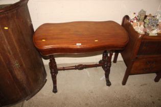 A Victorian mahogany fold-over card table