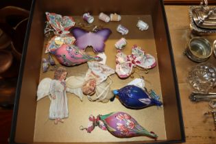 A box containing porcelain butterflies, thimbles e