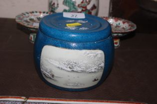 A Chinese pot and cover decorated winter scenes