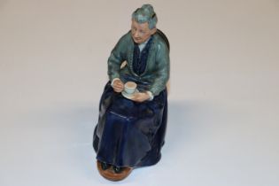 A Royal Doulton figurine "The Cup Of Tea" HN2322