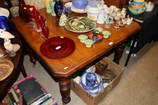 A Victorian walnut extending dining table